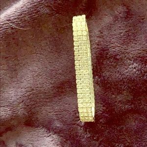 A adjustable bracelet with fake diamonds.